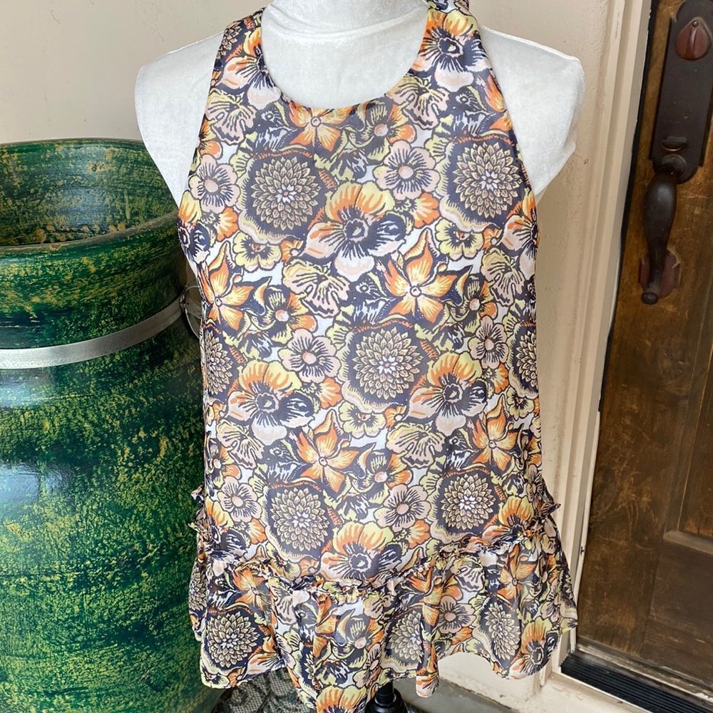 Floral sheer print fully lined sleeveless top with ruffled bottom size 4